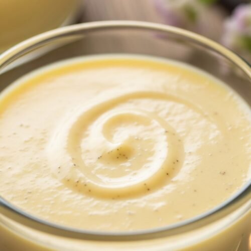 Homemade vanilla custard in a glass bowl